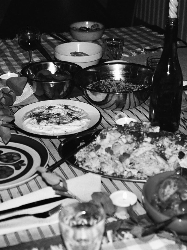 A black and white photograph of food on a table